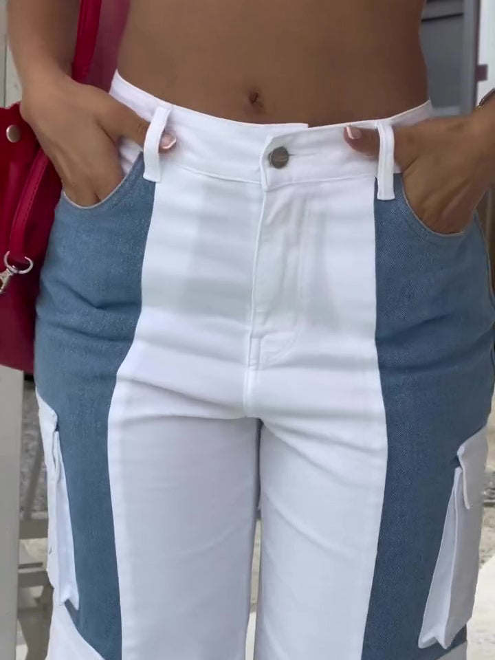 Women’s high-waist colorblock cargo pants featuring a wide-leg fit, bold blue-and-white contrast panels, and oversized utility pockets for a fresh streetwear-inspired look