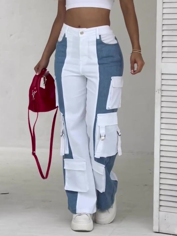 Women’s high-waist colorblock cargo pants featuring a wide-leg fit, bold blue-and-white contrast panels, and oversized utility pockets for a fresh streetwear-inspired look