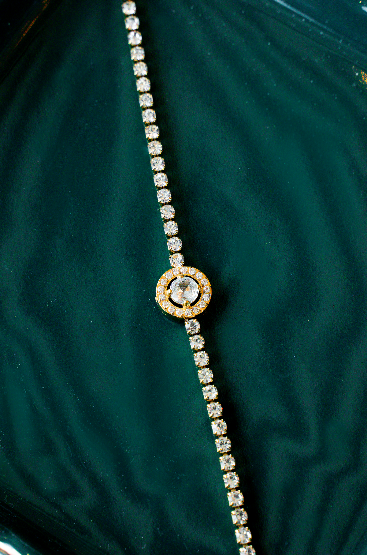 A little sparkle that pulls the whole look together- Gold-Tone Halo NORA Tennis Bracelet