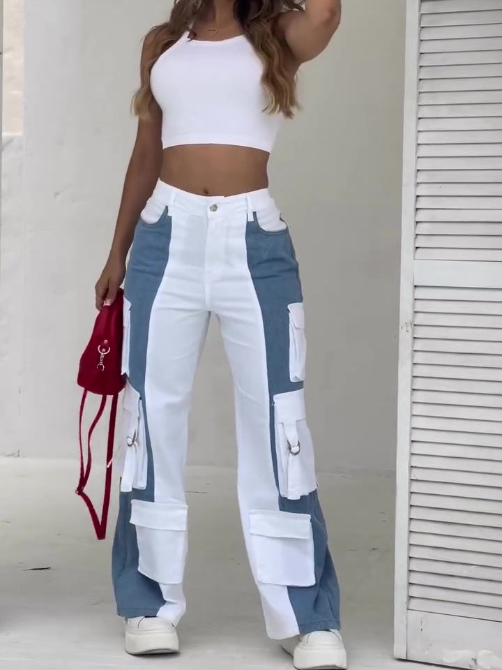 Women’s high-waist colorblock cargo pants featuring a wide-leg fit, bold blue-and-white contrast panels, and oversized utility pockets for a fresh streetwear-inspired look